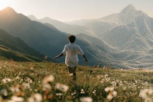 omlecka_A_young_man_in_white_shirt_running_joyful_in_the_natu_8319924b-5d83-4562-a4f0-1c7985bba482_3